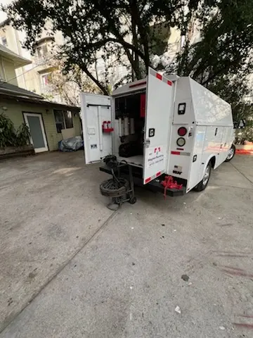 Magnet Plumbing service vehicle on-site for Grease Trap Cleaning in Gulf Coast
